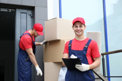 Small business office move preparation with desks, boxes, and IT equipment