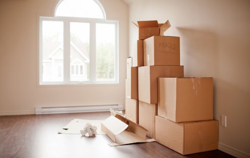 Commercial moving team preparing office furniture and equipment for relocation