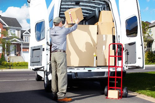 Removal team transporting household items through a central London building